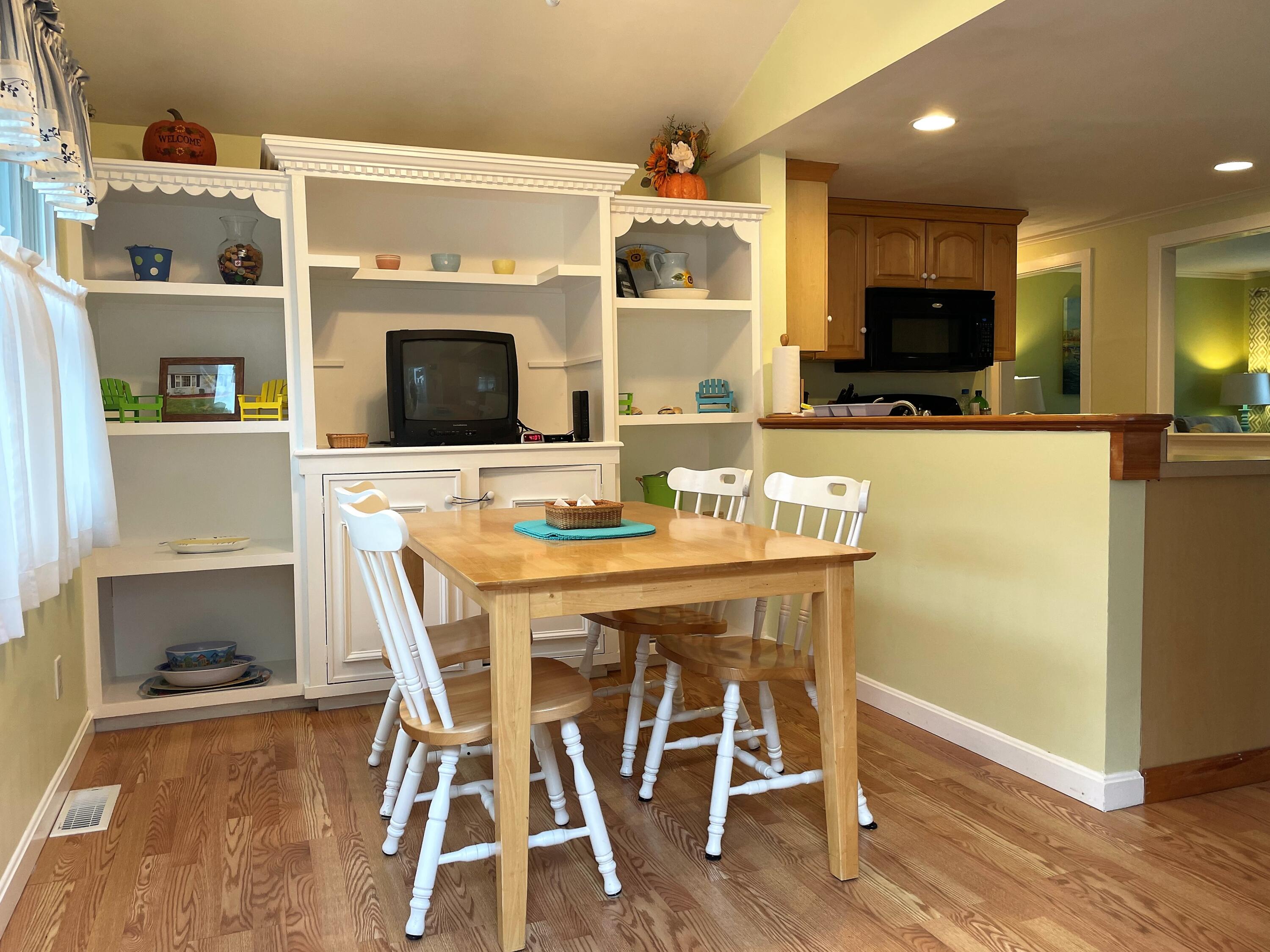 57 Suomi Road Hyannis, MA 02601 - Photo 5 of 11 a dining room with furniture and wooden floor