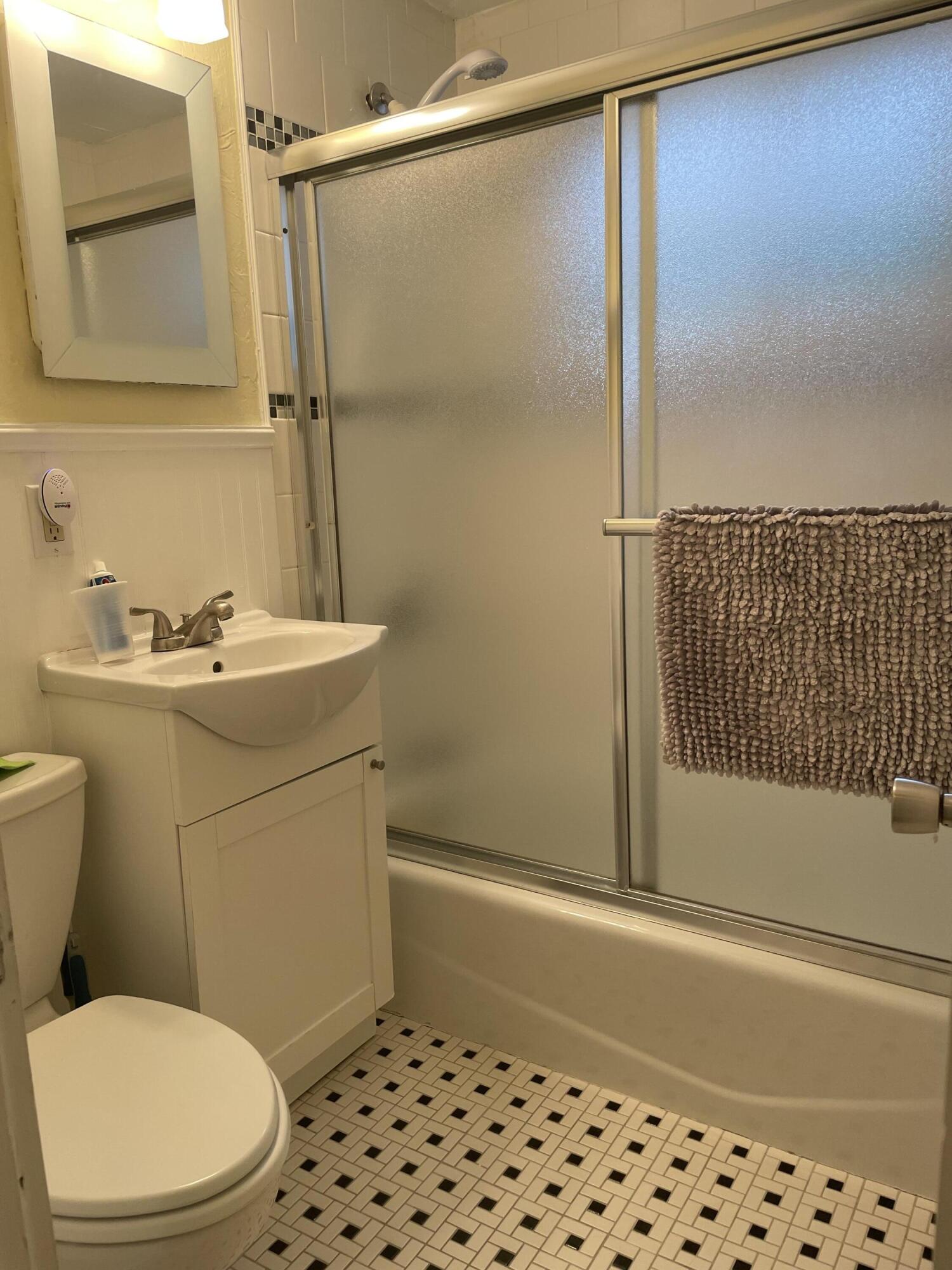 57 Suomi Road Hyannis, MA 02601 - Photo 8 of 11 a bathroom with a sink a toilet and shower