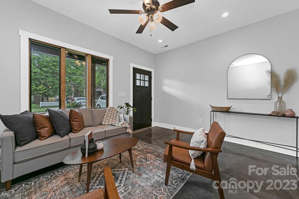 183 Neely Road Brevard, NC 28712 - Photo 17 of 44 a living room with furniture and a large window