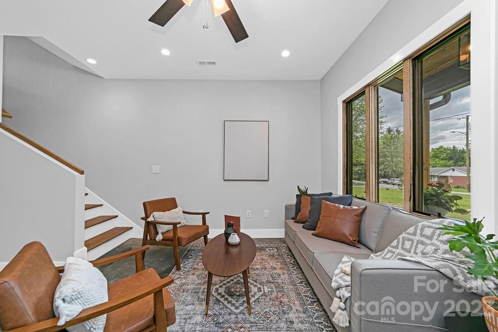 183 Neely Road Brevard, NC 28712 - Photo 18 of 44 a living room with furniture and a large window