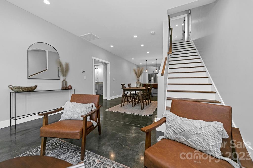 183 Neely Road Brevard, NC 28712 - Photo 19 of 44 a living room with furniture and a wooden floor