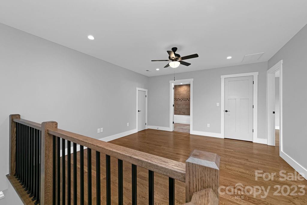 183 Neely Road Brevard, NC 28712 - Photo 26 of 44 a view of an empty room with wooden floor