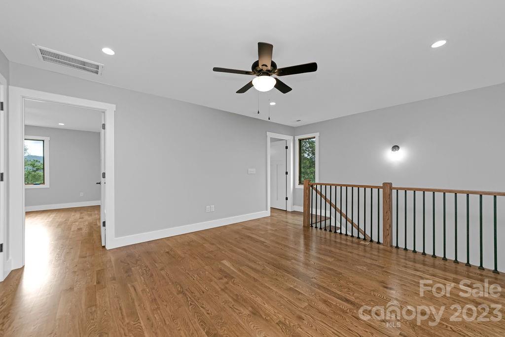 183 Neely Road Brevard, NC 28712 - Photo 27 of 44 a view of empty room with wooden floor