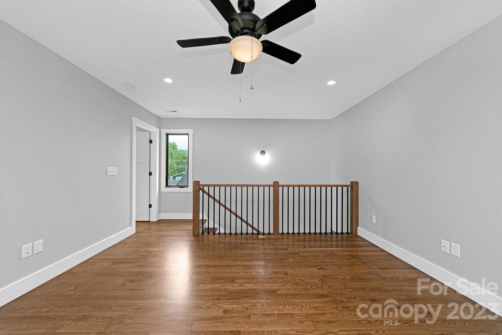 183 Neely Road Brevard, NC 28712 - Photo 28 of 44 wooden floor in an empty room with a window