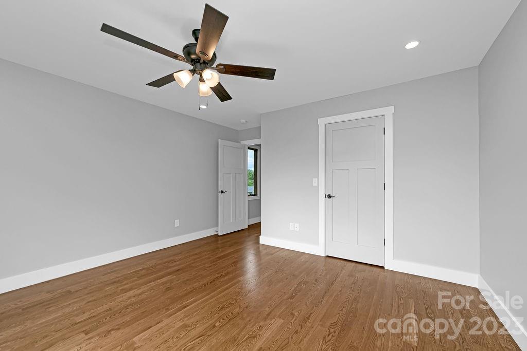 183 Neely Road Brevard, NC 28712 - Photo 29 of 44 a view of an empty room with wooden floor