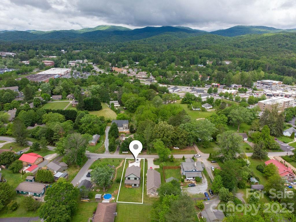 183 Neely Road Brevard, NC 28712 - Photo 42 of 44 an aerial view of residential houses with outdoor space and trees