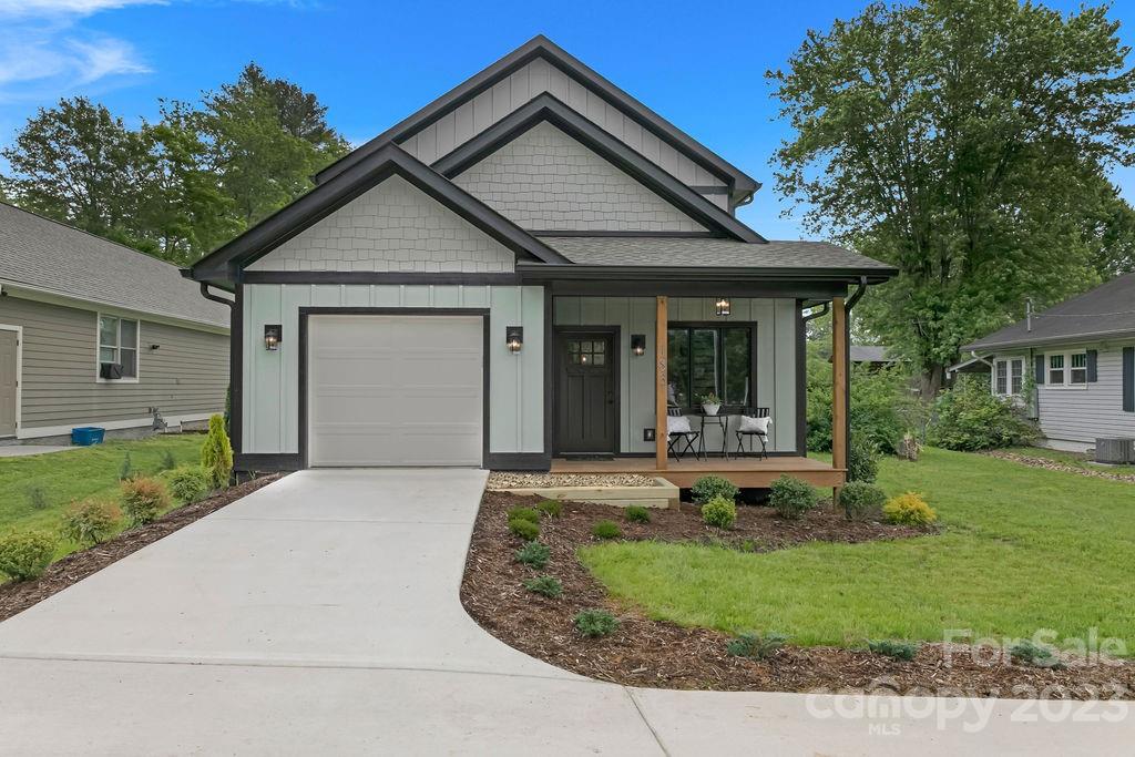 183 Neely Road Brevard, NC 28712 - Photo 7 of 44 a front view of a house with garden