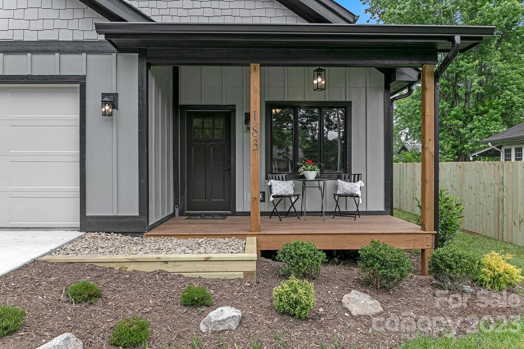 183 Neely Road Brevard, NC 28712 - Photo 8 of 44 a front view of a house with garden