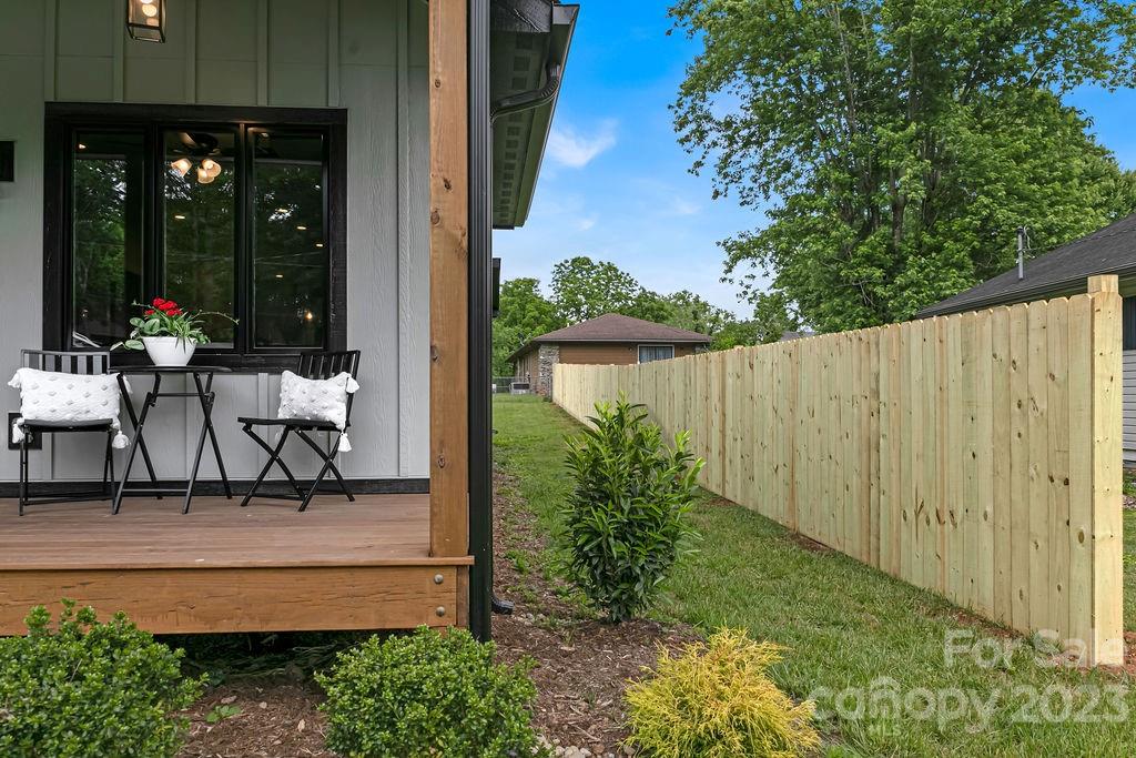 183 Neely Road Brevard, NC 28712 - Photo 9 of 44 a view of a bench in the patio next to a yard