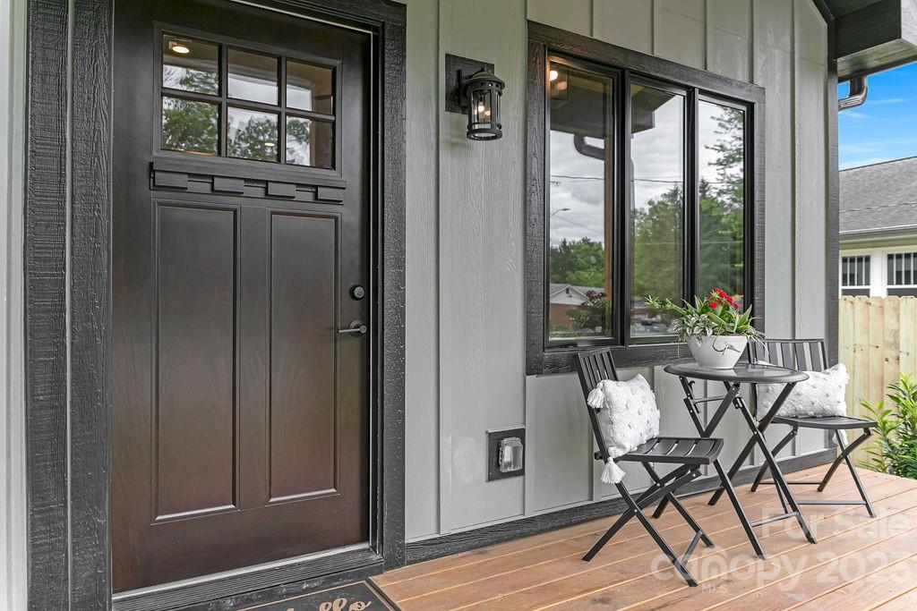183 Neely Road Brevard, NC 28712 - Photo 10 of 44 a view of a dining room with furniture window and wooden floor