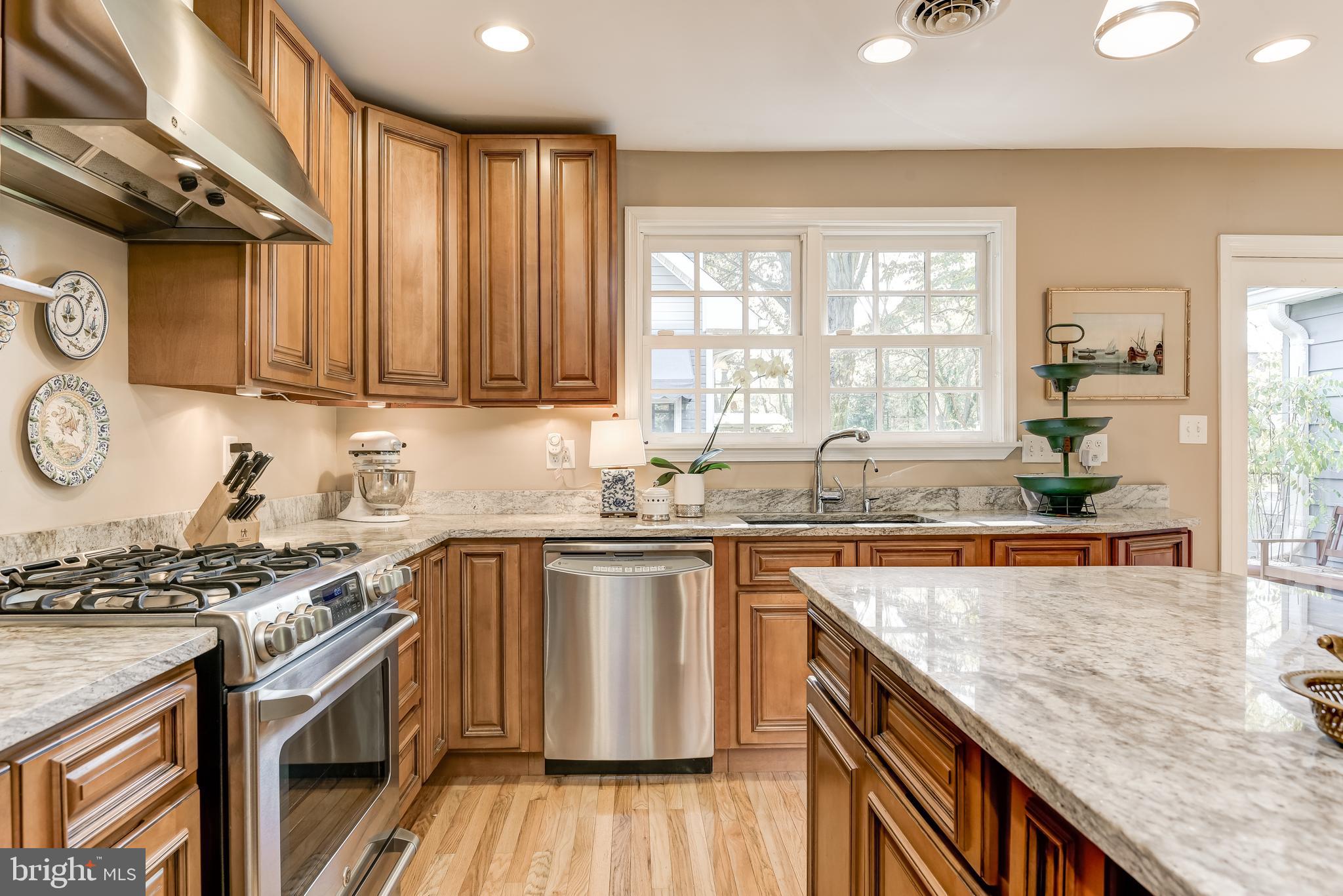 709 Black Forest Road Annapolis, MD 21409 - Photo 13 of 49 Gas range and glazed maple cabinetry