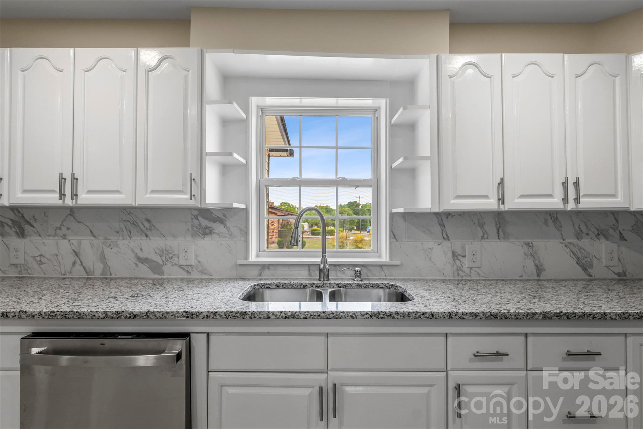2480 Artz Road Salisbury, NC 28146 - Photo 21 of 33 a kitchen with granite countertop a sink a window and cabinets