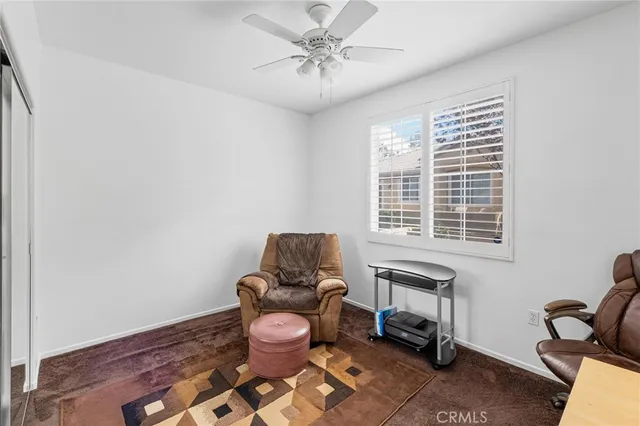 a work room with furniture and windows