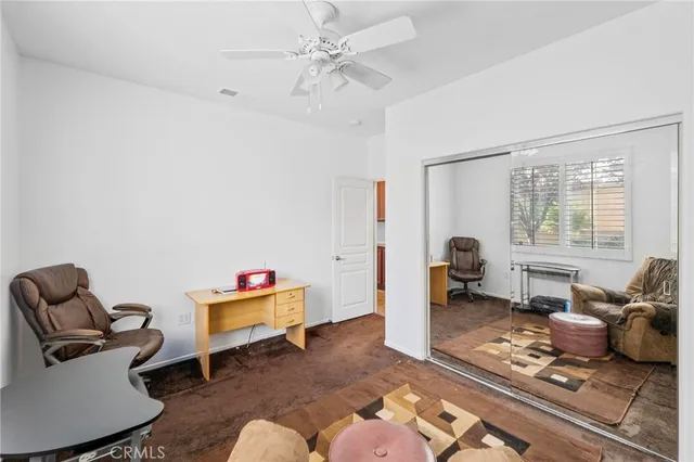 a living room with furniture a rug and a window
