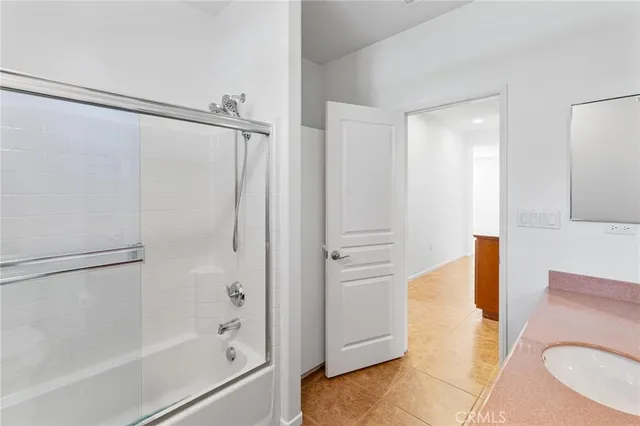 a bathroom with a tub and shower