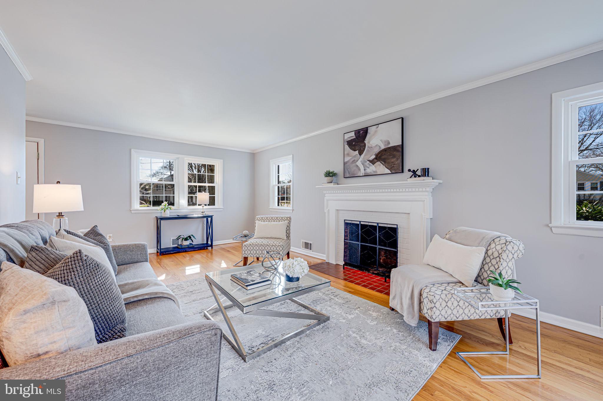 1122 Waynewood Boulevard Alexandria, VA 22308 - Photo 11 of 51 a living room with furniture and a fireplace