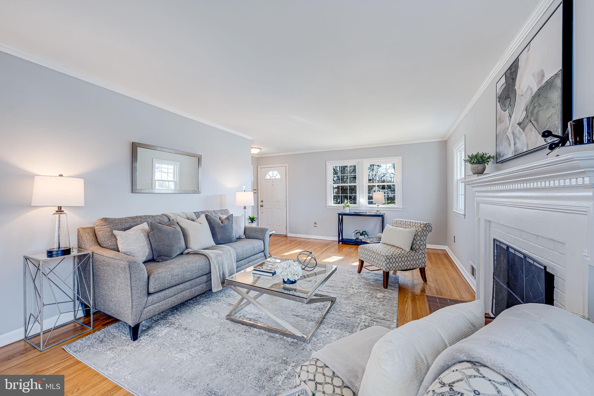 1122 Waynewood Boulevard Alexandria, VA 22308 - Photo 12 of 51 a living room with furniture fireplace and a lamp