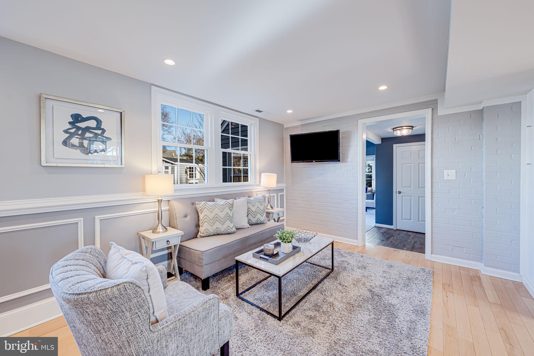 1122 Waynewood Boulevard Alexandria, VA 22308 - Photo 13 of 51 a living room with furniture and a flat screen tv
