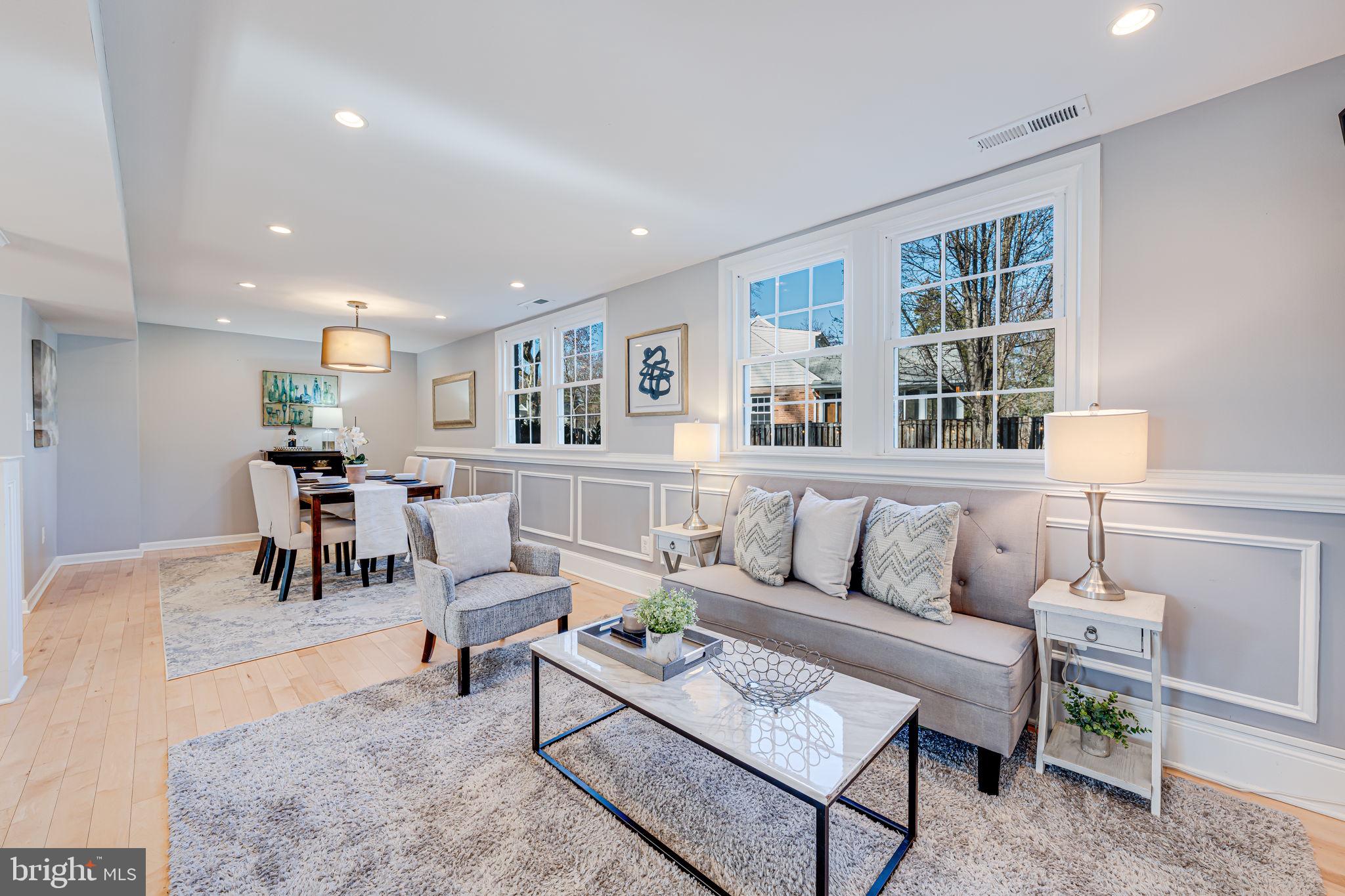 1122 Waynewood Boulevard Alexandria, VA 22308 - Photo 17 of 51 a living room with furniture and a table