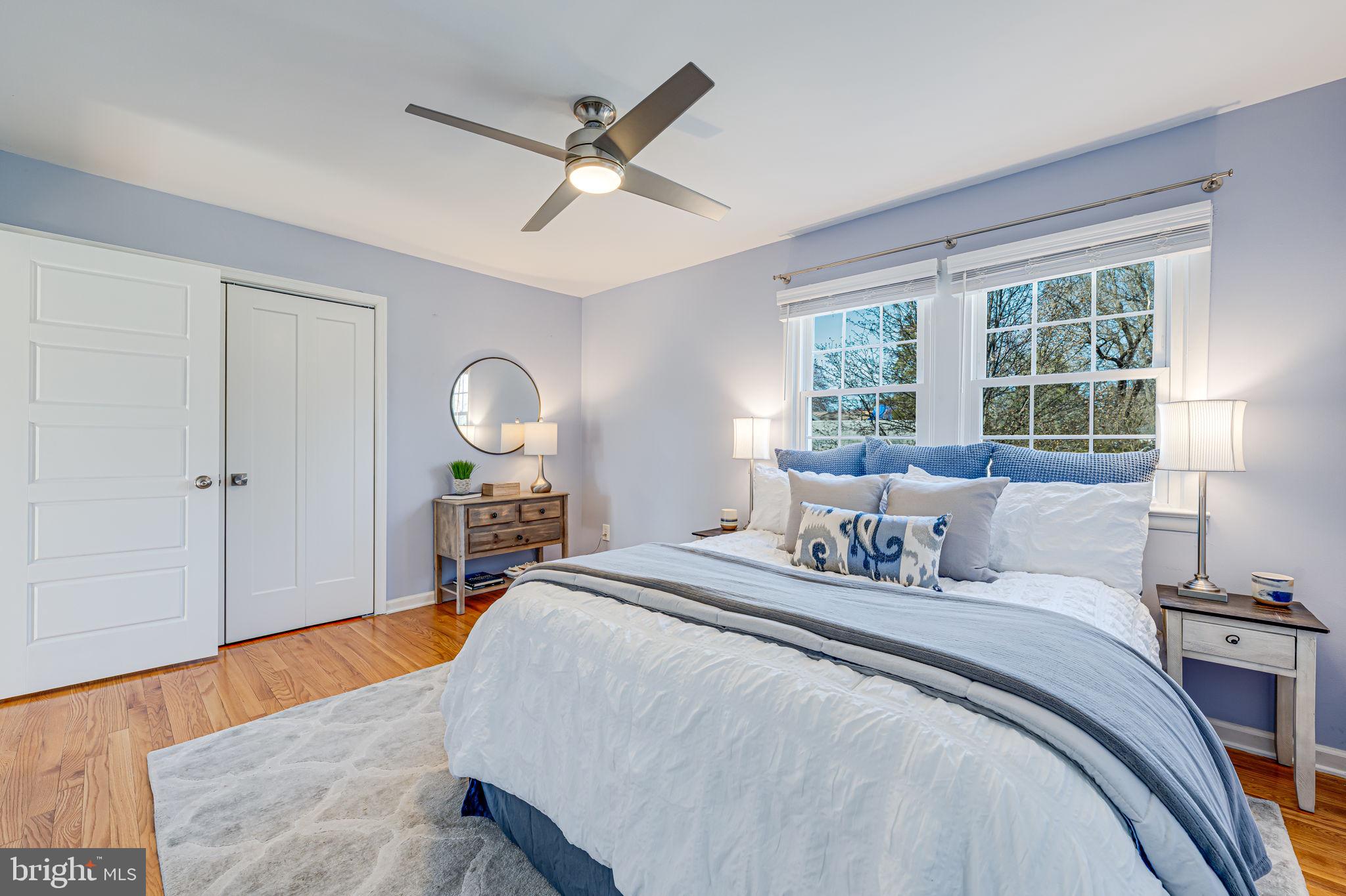 1122 Waynewood Boulevard Alexandria, VA 22308 - Photo 21 of 51 a bedroom with a bed and wooden floor