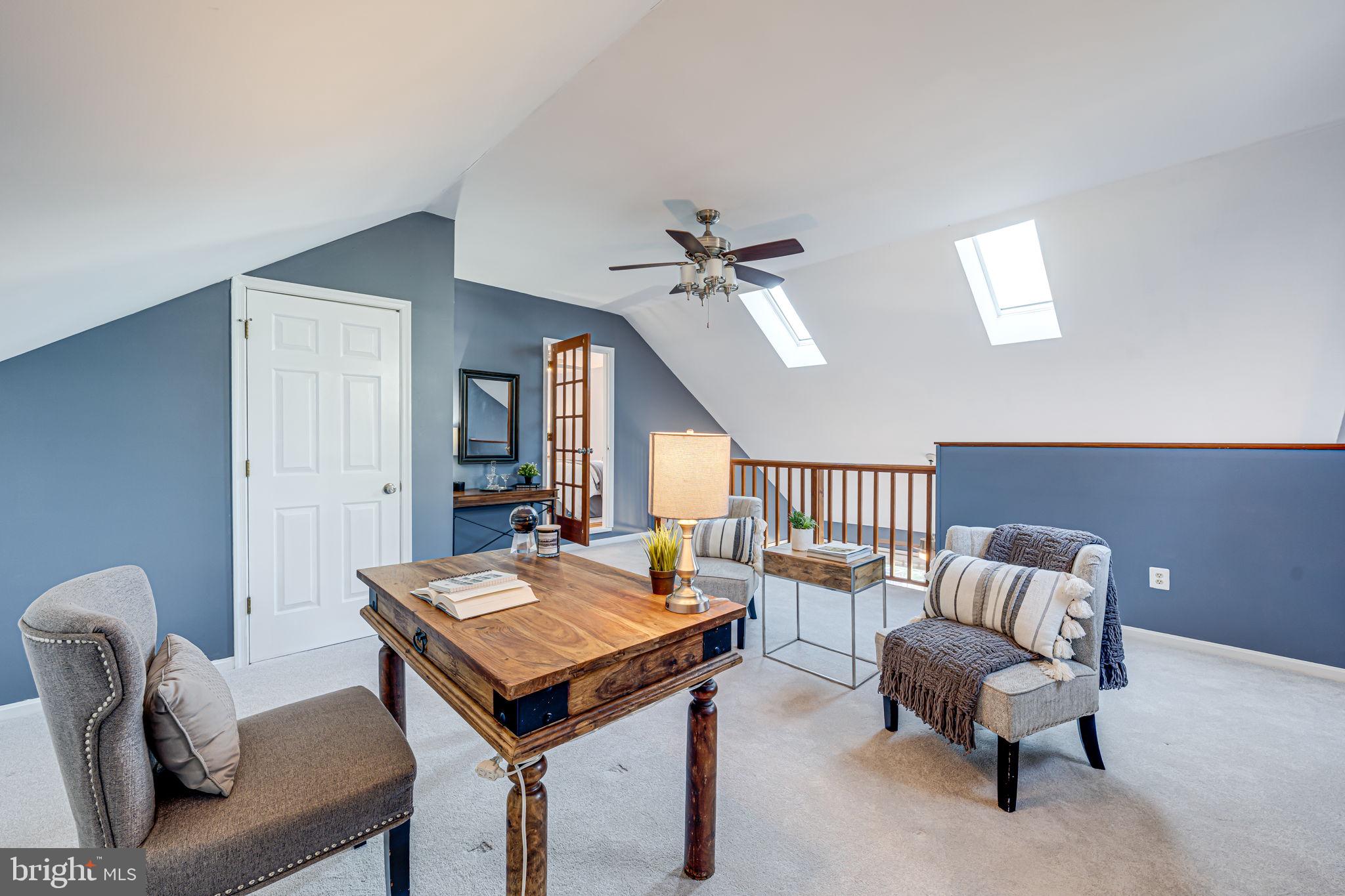 1122 Waynewood Boulevard Alexandria, VA 22308 - Photo 23 of 51 a living room with furniture and a chandelier