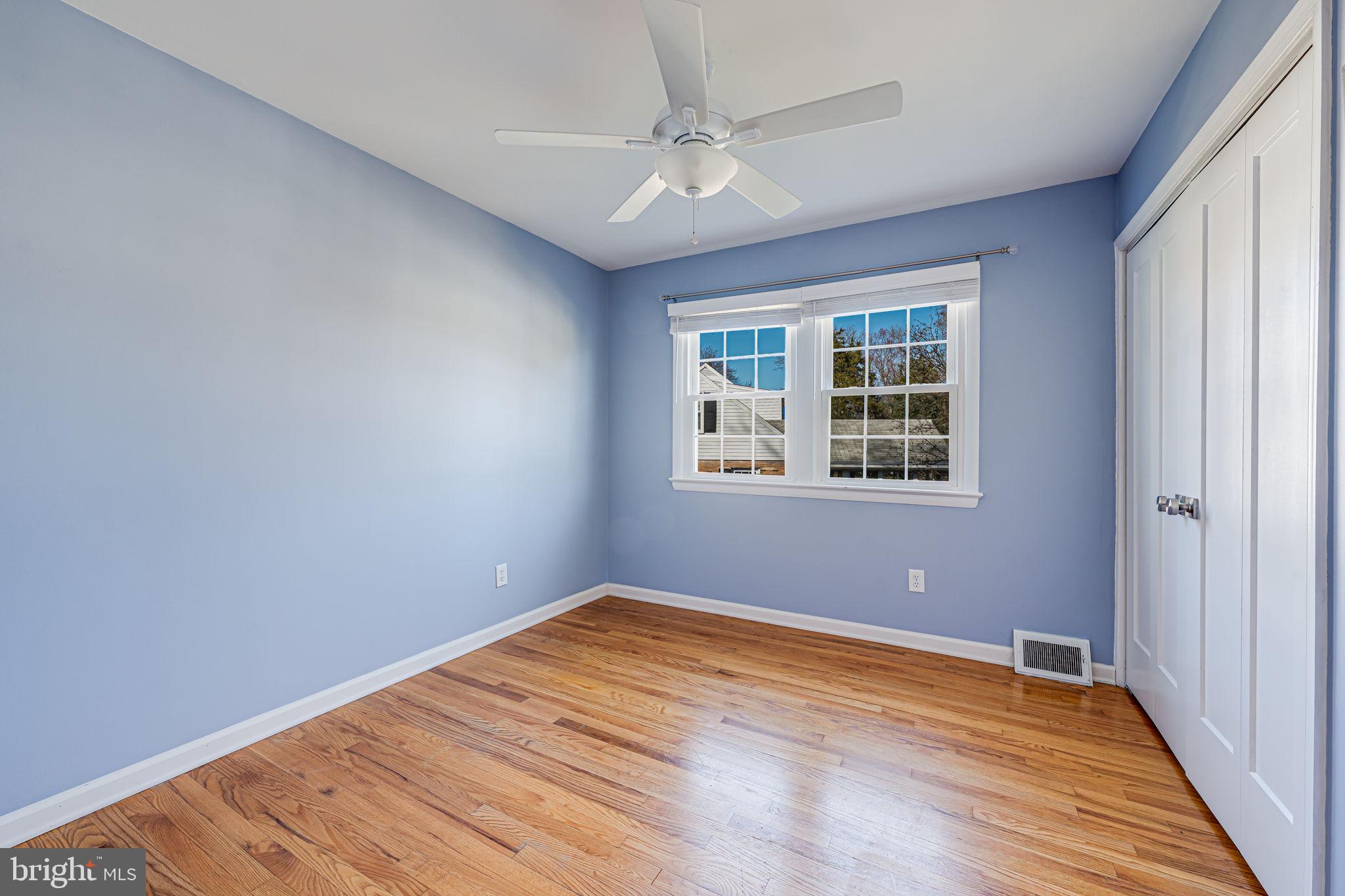 1122 Waynewood Boulevard Alexandria, VA 22308 - Photo 25 of 51 a view of empty room with wooden floor and fan