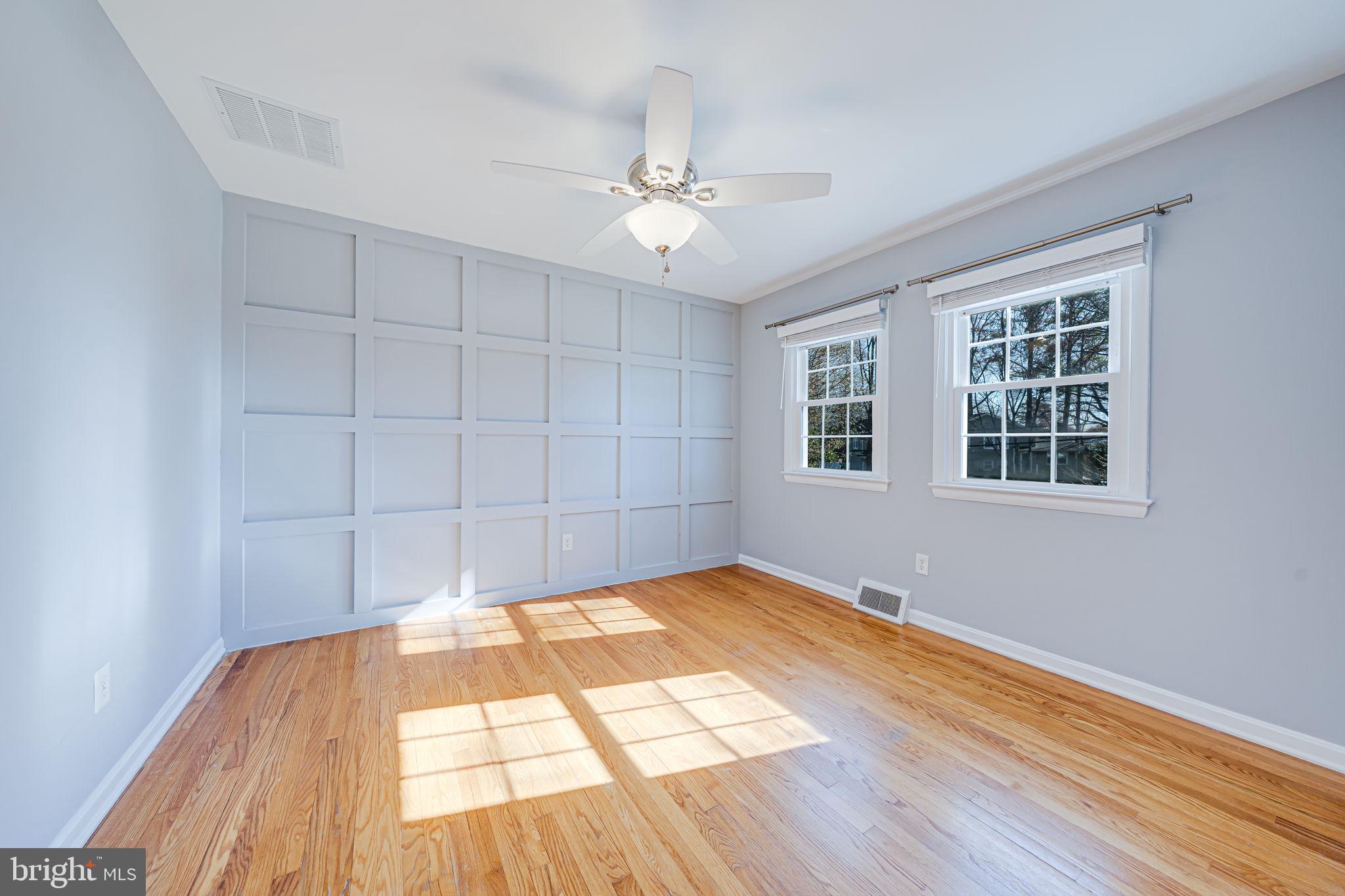 1122 Waynewood Boulevard Alexandria, VA 22308 - Photo 27 of 51 a view of empty room with wooden floor and fan