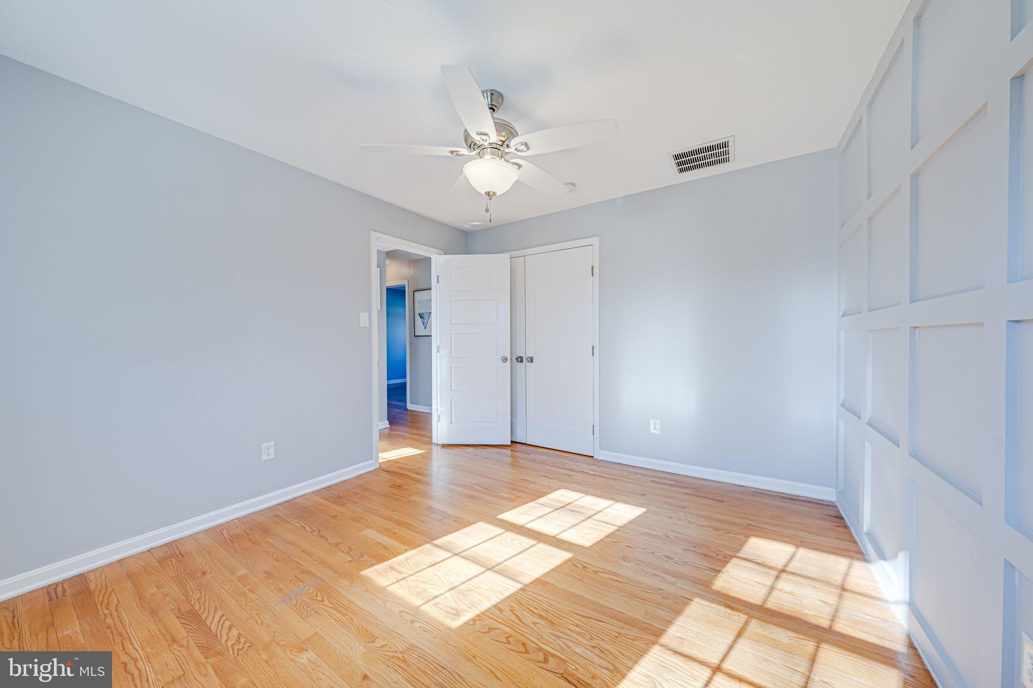 1122 Waynewood Boulevard Alexandria, VA 22308 - Photo 28 of 51 a view of an empty room with window and chandelier fan