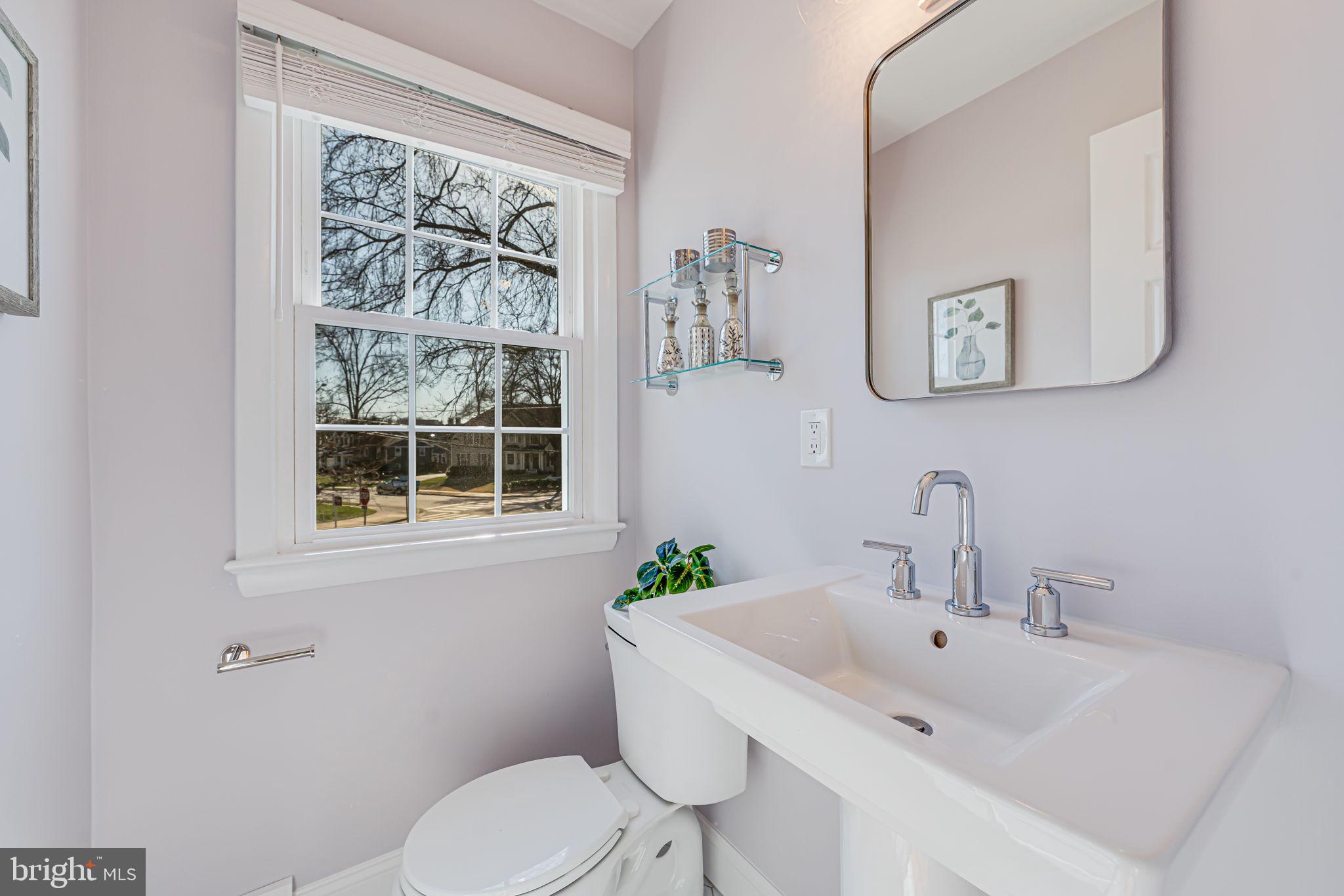 1122 Waynewood Boulevard Alexandria, VA 22308 - Photo 29 of 51 a bathroom with a sink and a toilet