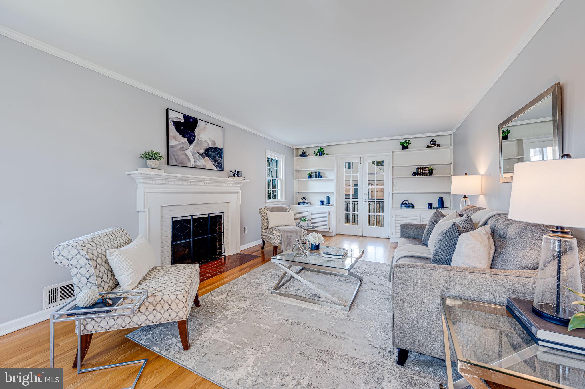 1122 Waynewood Boulevard Alexandria, VA 22308 - Photo 8 of 51 a living room with furniture and a fireplace