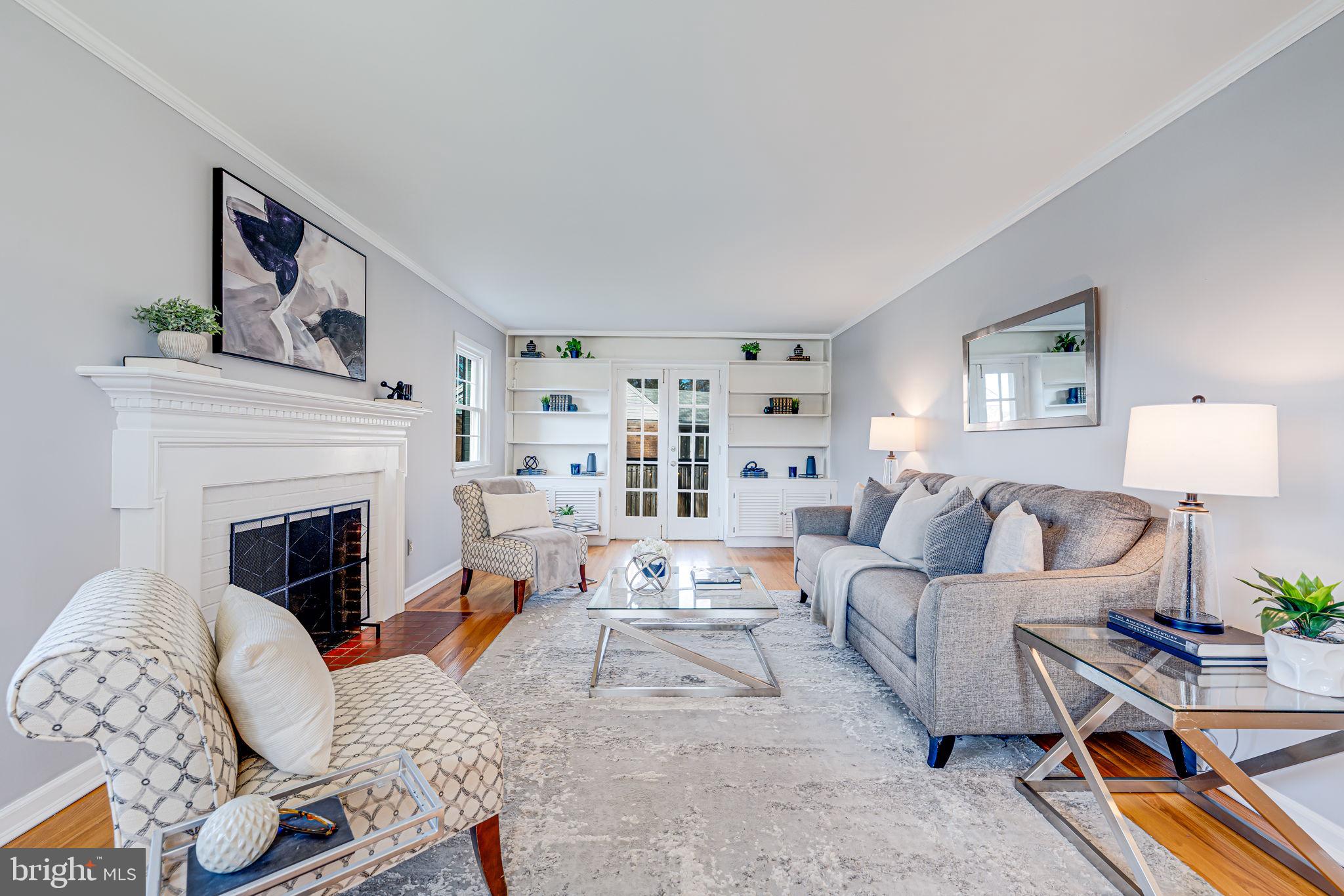 1122 Waynewood Boulevard Alexandria, VA 22308 - Photo 10 of 51 a living room with furniture and a fireplace