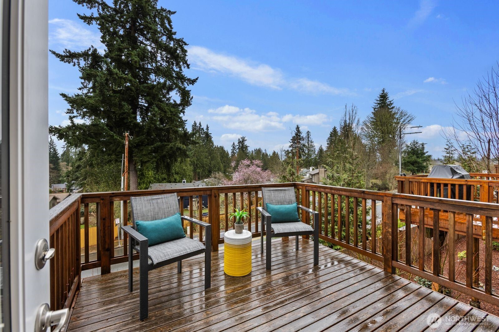 1621 Seattle Hill Road, Unit C4 Bothell, WA 98012 - Photo 12 of 35 a view of balcony with wooden floor and outdoor seating