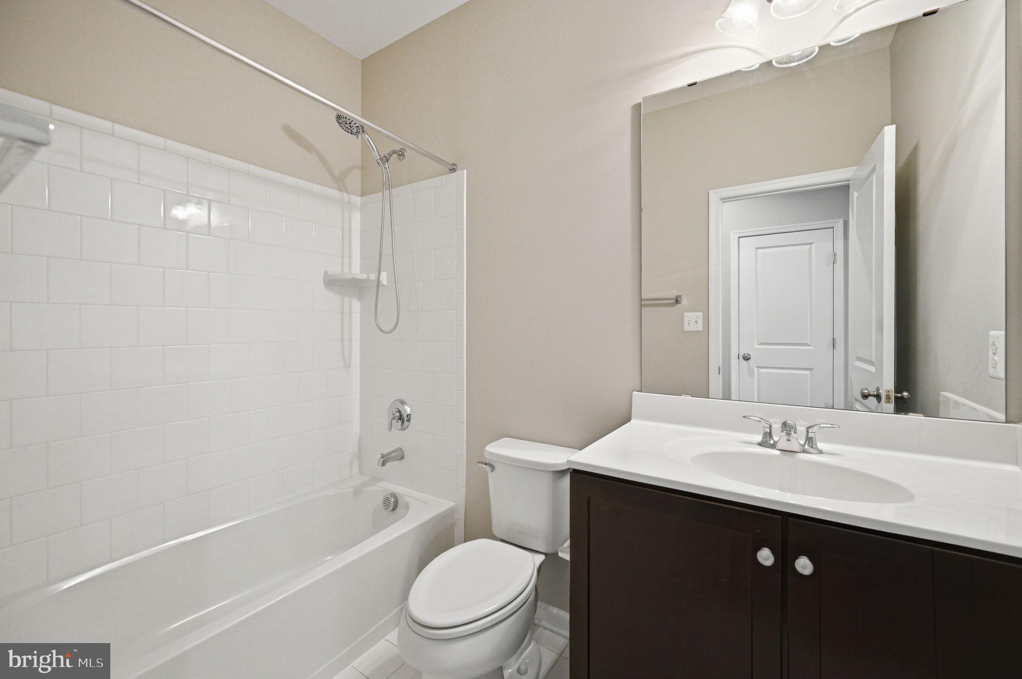 650 Aspen Road, Unit 108 Stafford, VA 22554 - Photo 14 of 26 Modern bathroom with sleek finishes.