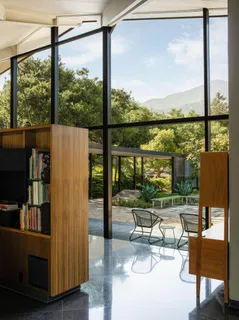 a view of a kitchen with furniture and windows