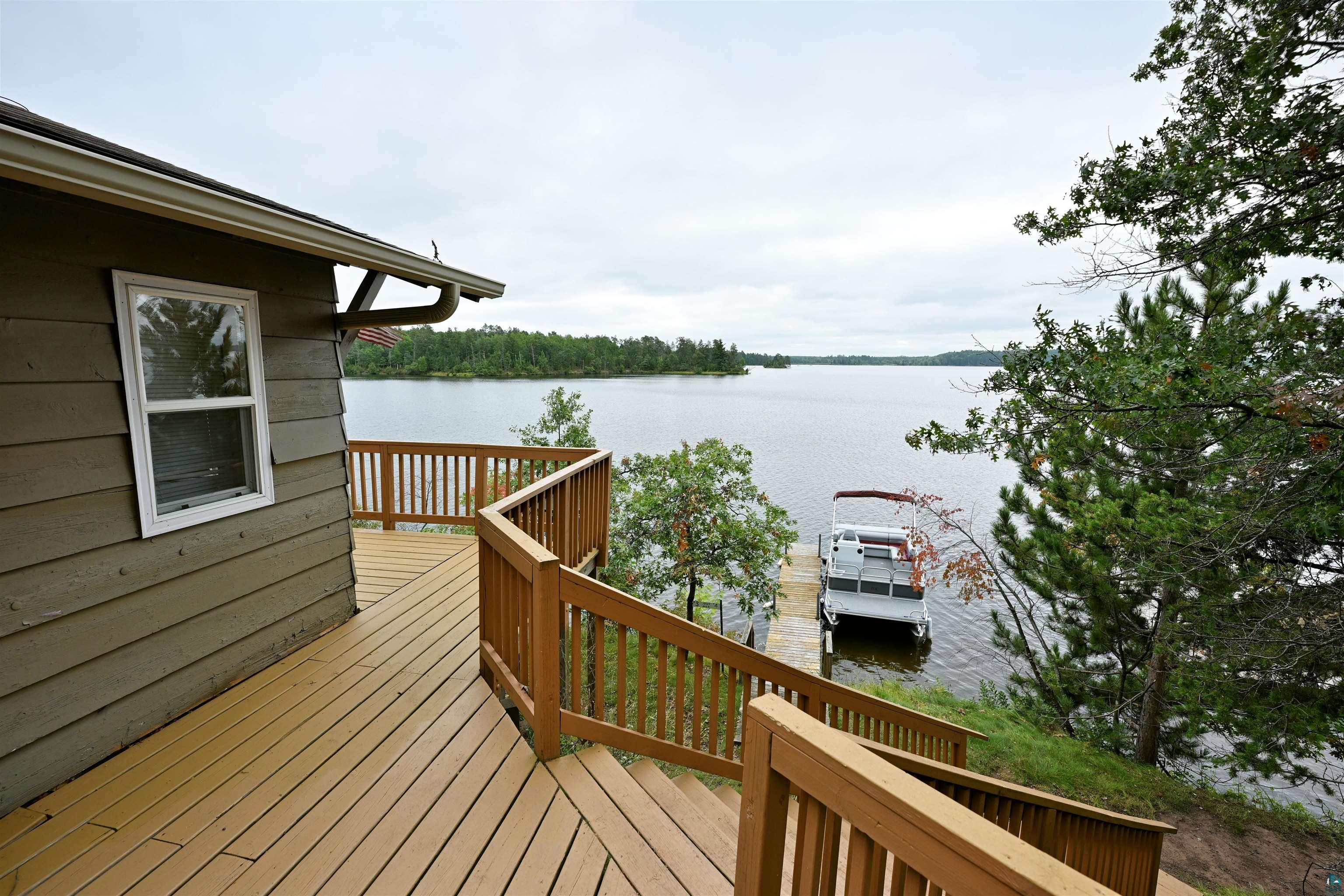 6833 View Point Lodge Road Gordon, WI 54838 - Photo 29 of 40 Wooden terrace featuring a water view