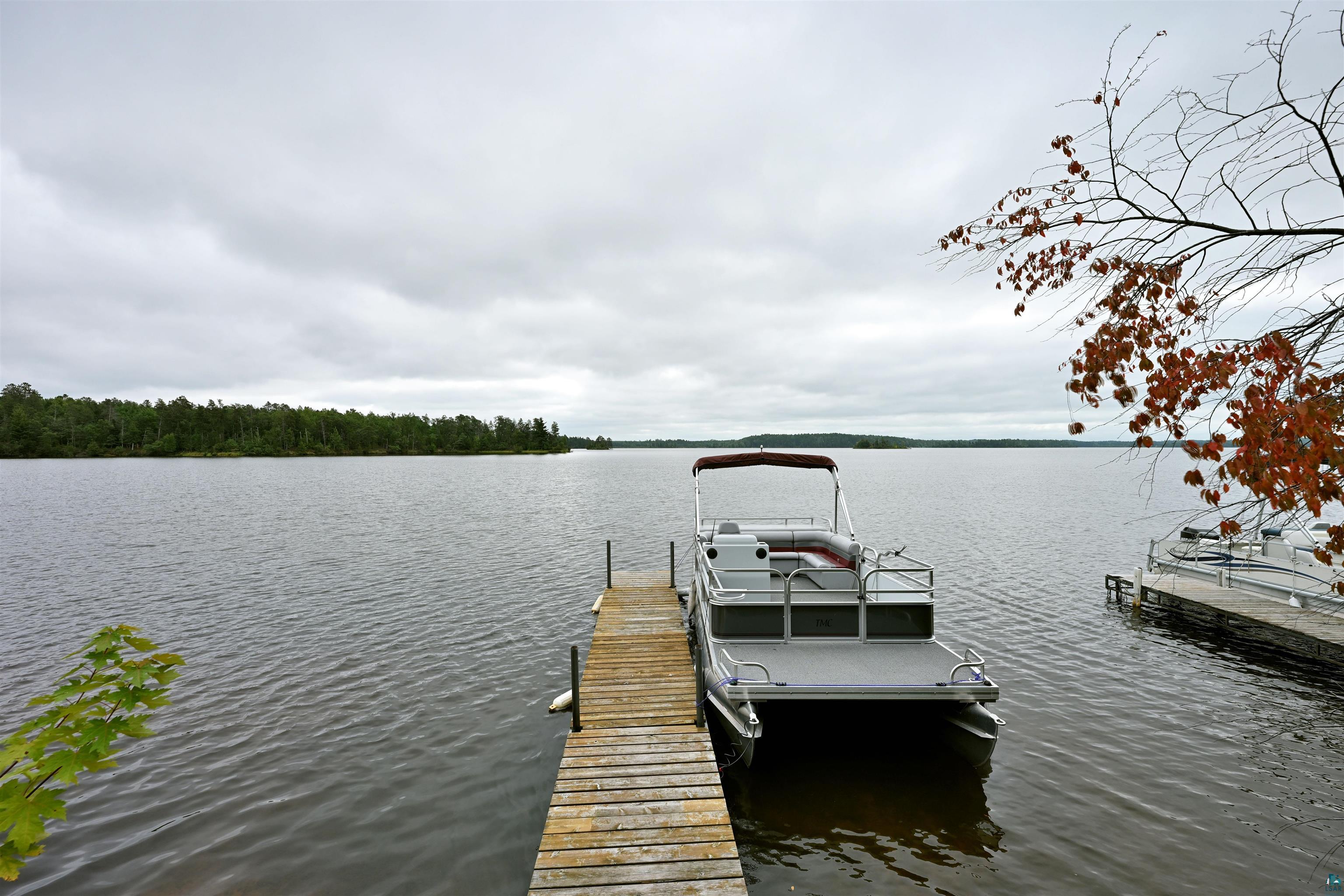 6833 View Point Lodge Road Gordon, WI 54838 - Photo 35 of 40 Dock with a water view and boat lift