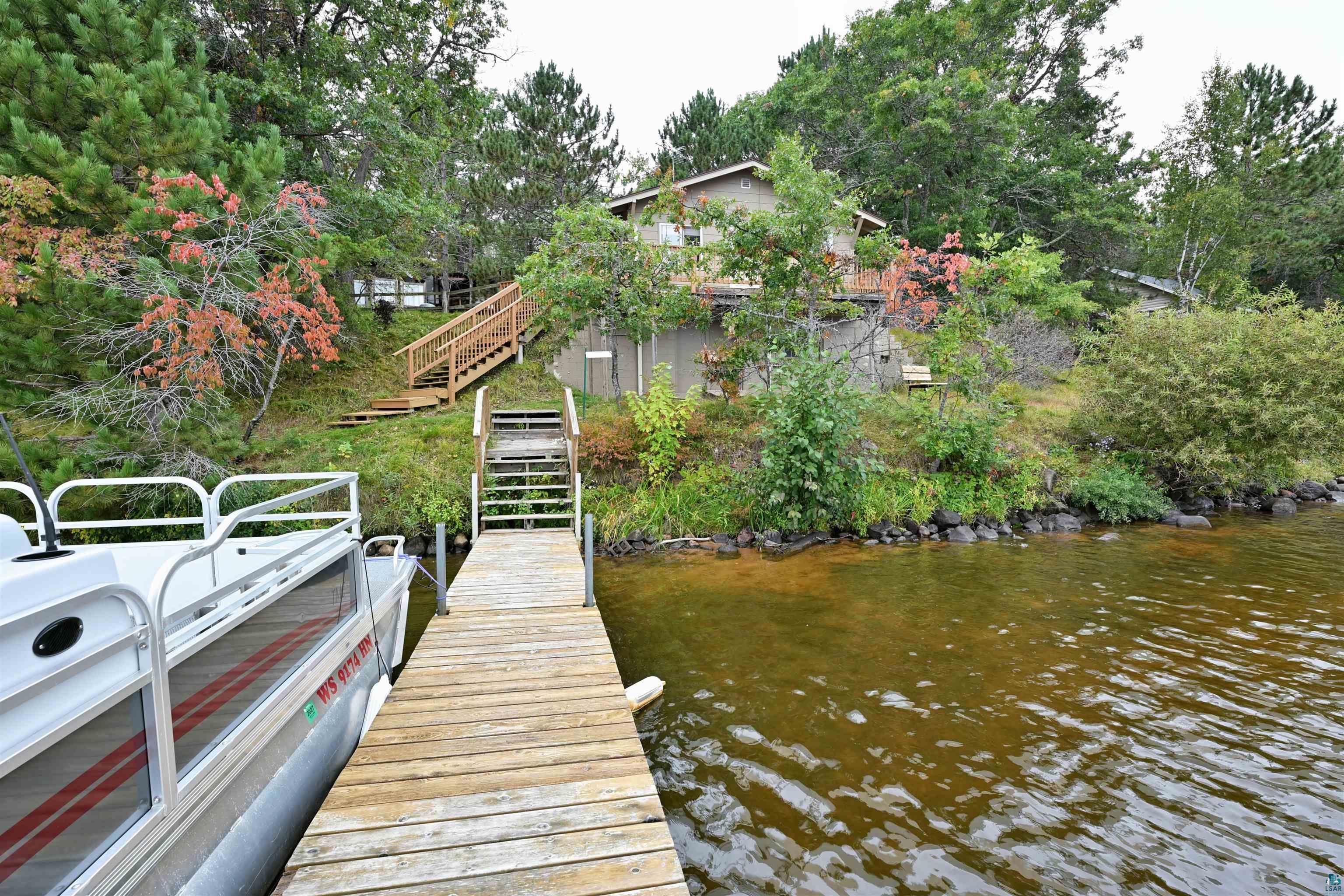 6833 View Point Lodge Road Gordon, WI 54838 - Photo 37 of 40 Dock area with stairs and a water view