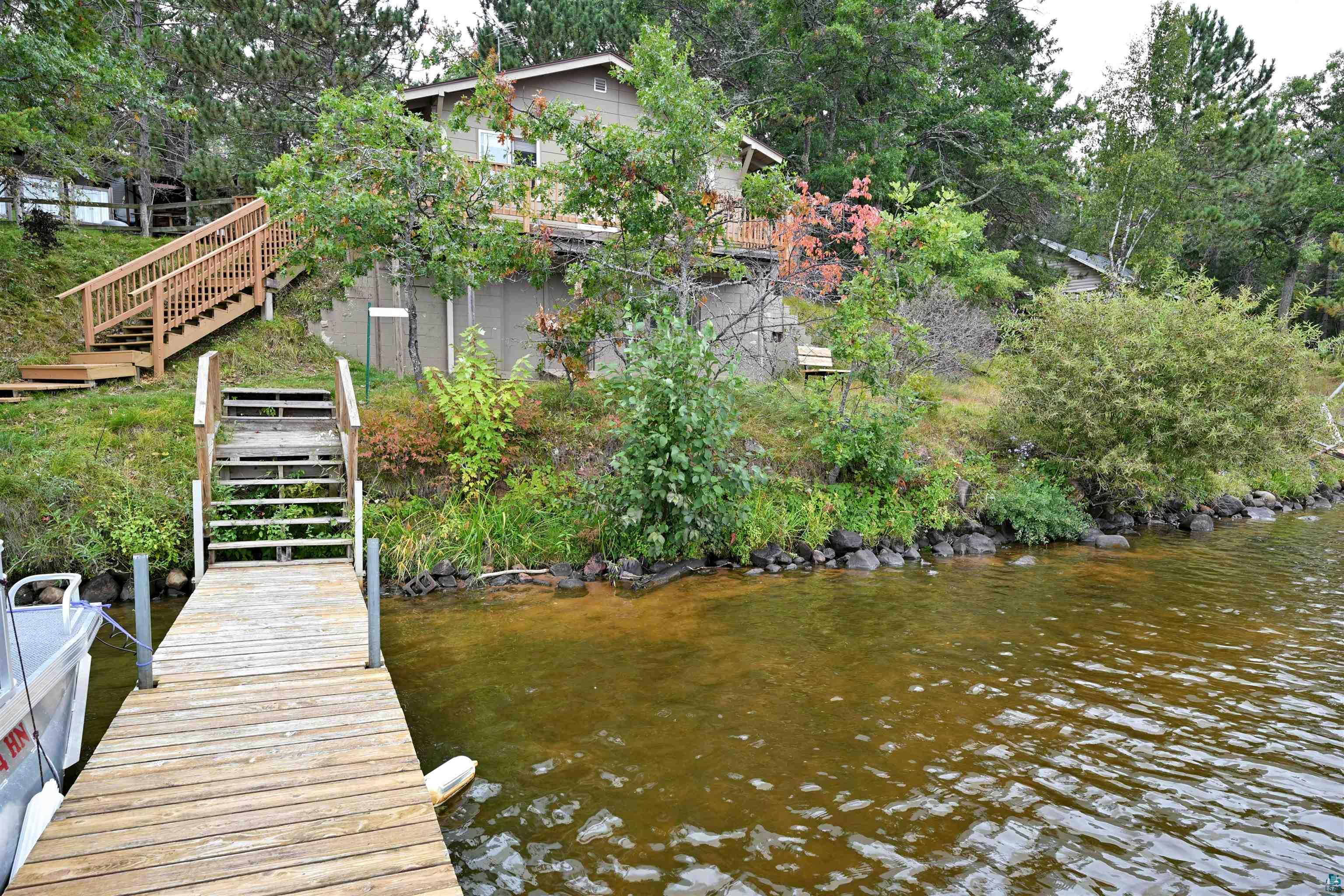 6833 View Point Lodge Road Gordon, WI 54838 - Photo 38 of 40 Dock area with stairs and a water view