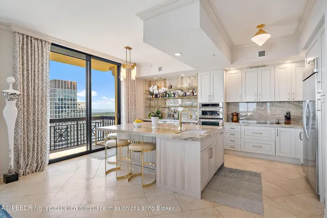 a very nice looking living room with a large window and a wooden floor
