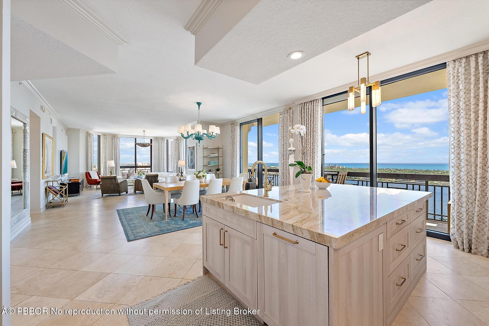 701 South Olive Avenue, Unit 2012 PH West Palm Beach, FL 33401 - Photo 13 of 42 a very nice looking living room with a large window and a wooden floor