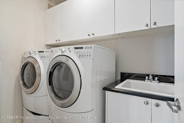 a spacious bedroom with a bed and a large window