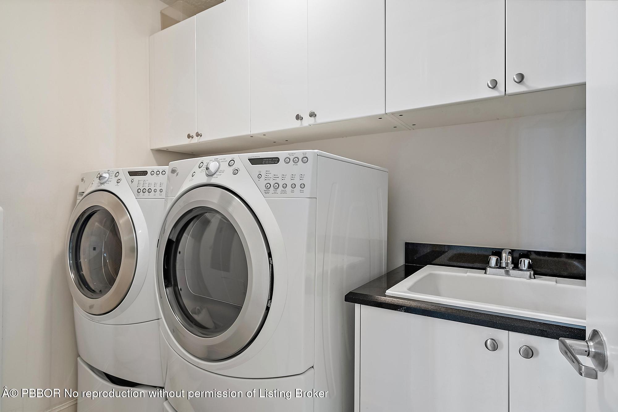 701 South Olive Avenue, Unit 2012 PH West Palm Beach, FL 33401 - Photo 17 of 42 a utility room with dryer and washer