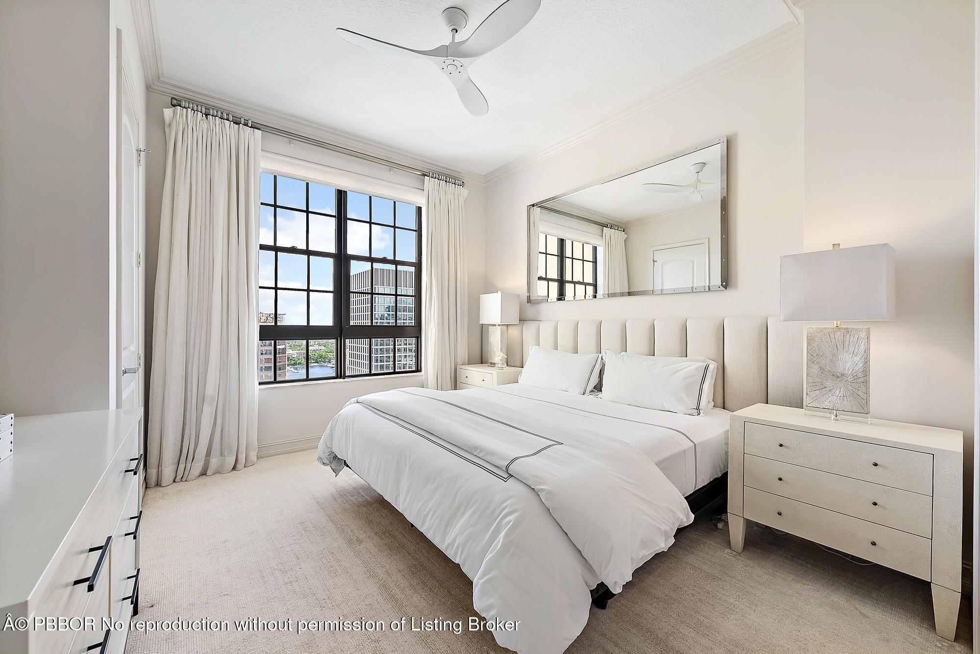 701 South Olive Avenue, Unit 2012 PH West Palm Beach, FL 33401 - Photo 22 of 42 a bedroom with a bed and a large window