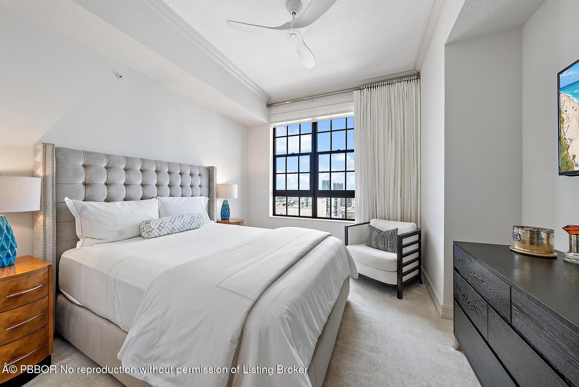 701 South Olive Avenue, Unit 2012 PH West Palm Beach, FL 33401 - Photo 25 of 42 a bedroom with a bed and a window