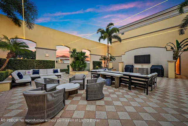 a view of a backyard with sitting area