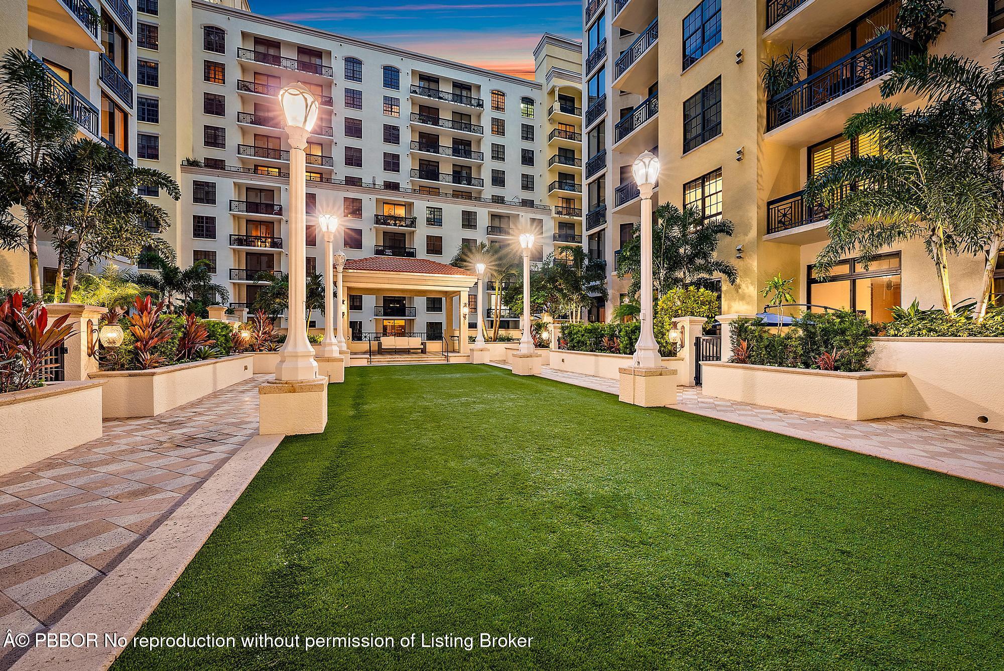 701 South Olive Avenue, Unit 2012 PH West Palm Beach, FL 33401 - Photo 32 of 42 a view of a building with a yard