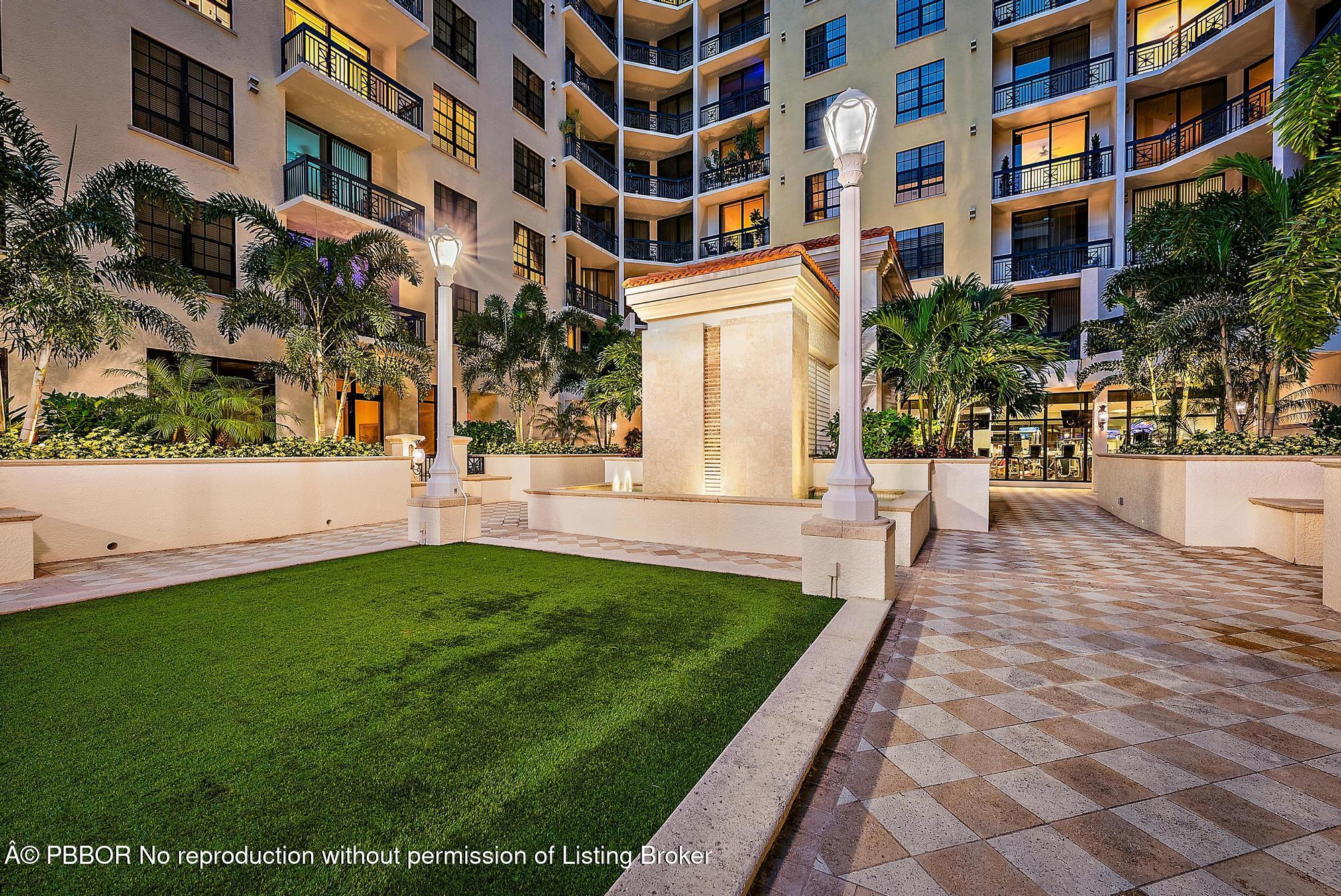 701 South Olive Avenue, Unit 2012 PH West Palm Beach, FL 33401 - Photo 33 of 42 a view of a building with garden