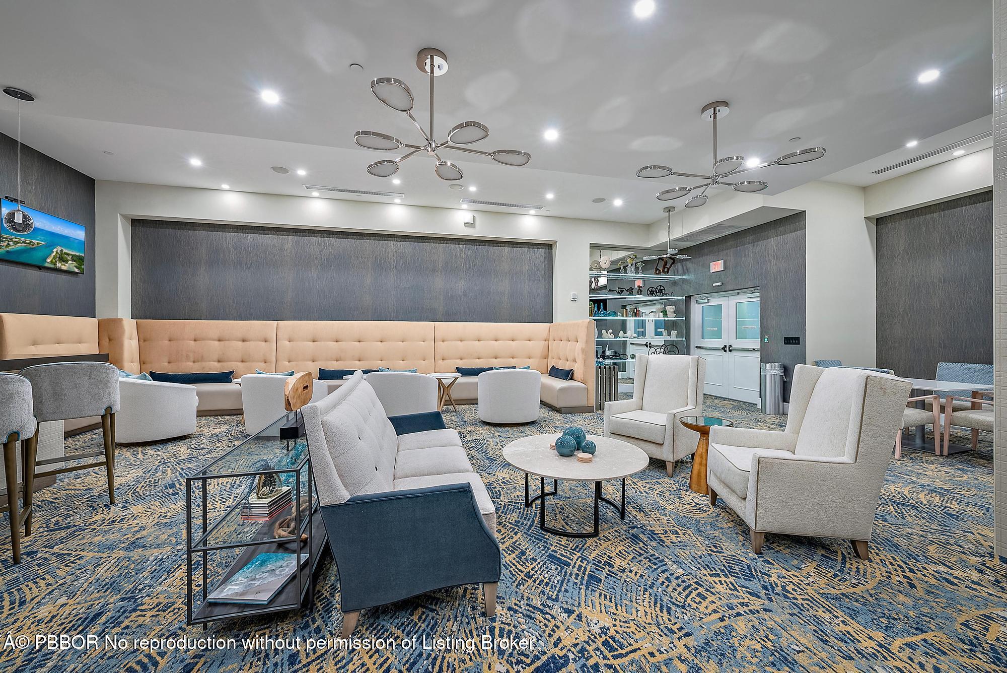 701 South Olive Avenue, Unit 2012 PH West Palm Beach, FL 33401 - Photo 37 of 42 a living room with furniture and a chandelier