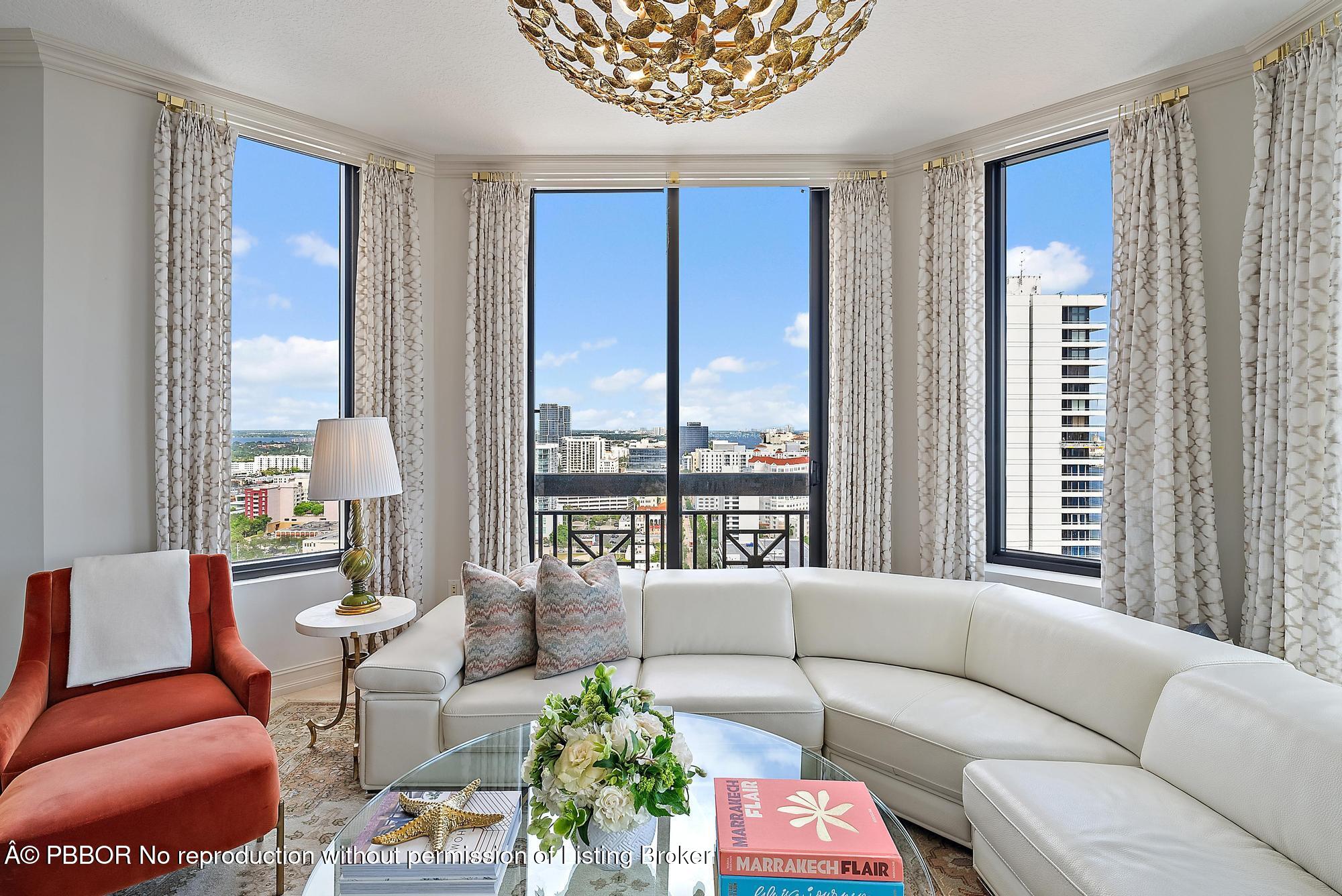 701 South Olive Avenue, Unit 2012 PH West Palm Beach, FL 33401 - Photo 6 of 42 a living room with furniture and a large window