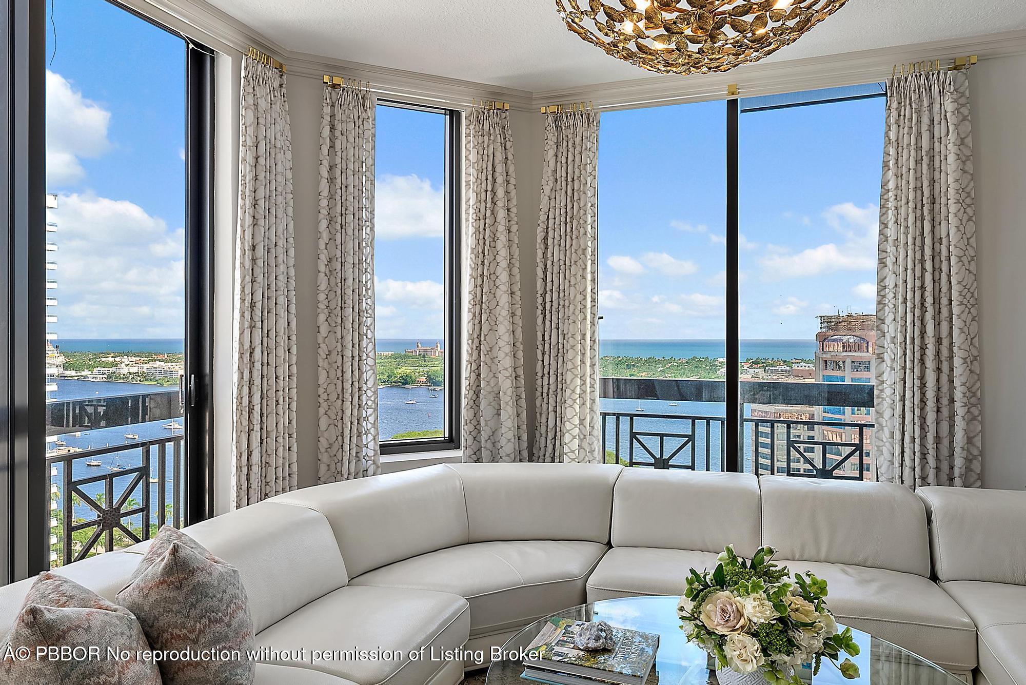 701 South Olive Avenue, Unit 2012 PH West Palm Beach, FL 33401 - Photo 7 of 42 a living room with furniture and a large window